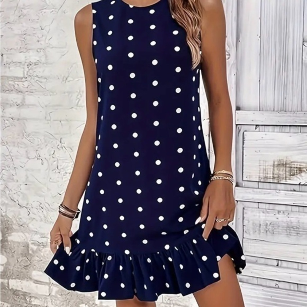 Navy and white sleeveless polkadot dress with ruffle bottom